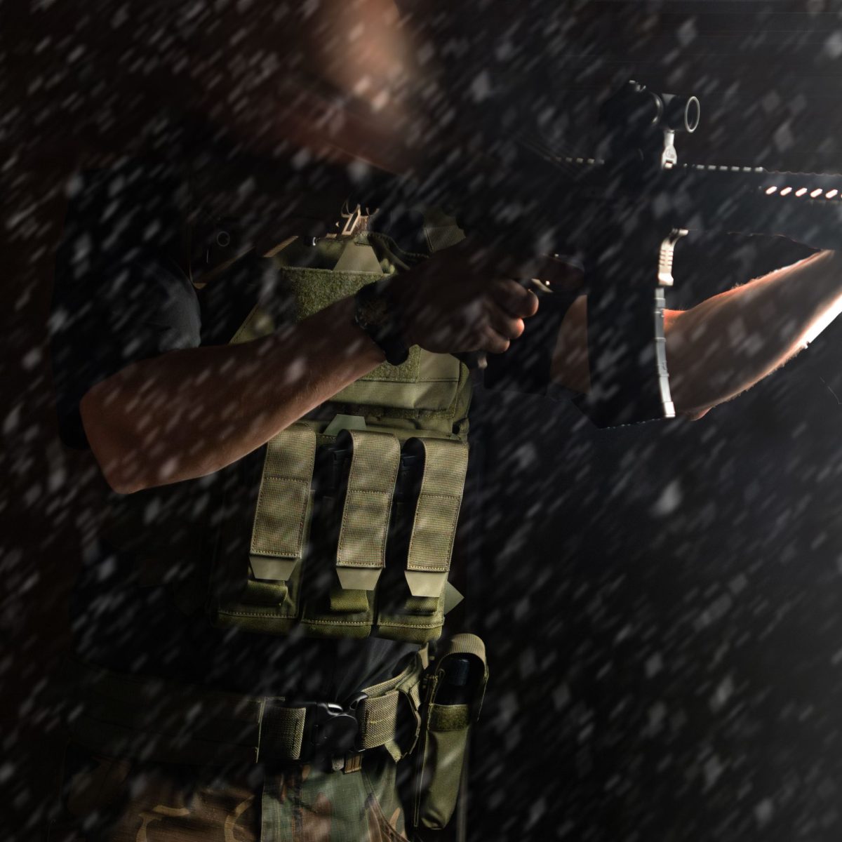 A tactical operator wearing an olive drab plate carrier and battle belt, aiming a rifle in a snowy environment, prepared for cold-weather tactical operations.